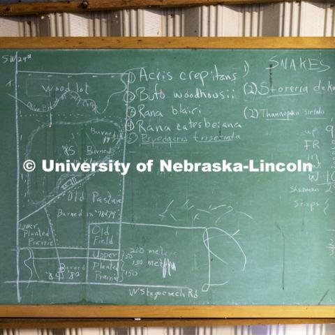 A chalkboard shows a diagram of the Reller Prairie Field Station. The history Reller Prairie Field Station south of Martell, Nebraska. August 3, 2021. Photo by Craig Chandler / University Communication.