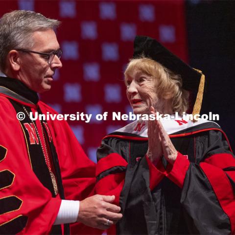 Leta Powell Drake, local television pioneer and Husker alumna, is congratulated by Chancellor Ronnie Green. Drake was presented with an honorary Doctor of Humane Letters during the undergraduate ceremony. Undergraduate Commencement at Pinnacle Bank Arena. August 14, 2021. Photo by Craig Chandler / University Communication.