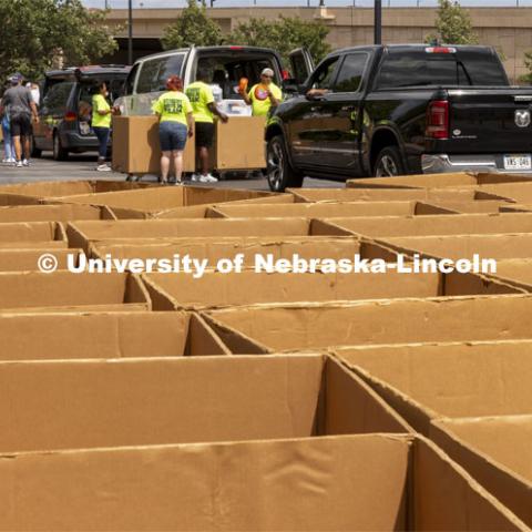 Dozens of boxes await their turn to help move Husker into their residence halls. Early arrival move-in for sorority rush, First Husker and Emerging Leaders. August 15, 2021. Photo by Craig Chandler / University Communication.