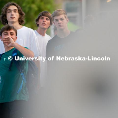 Students take turns trying to throw a basketball into a kid’s sized hoop during the Big Red Welcome Street Festival. The Street Festival was held on East Memorial Stadium Loop between the College of Business and Memorial Stadium. August 22, 2021. Photo by Jordan Opp for University Communication.