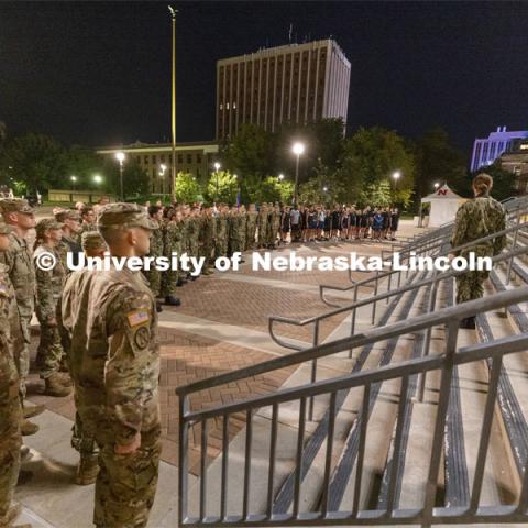 UNL ROTC cadets and Lincoln first responders stand in formation on the east stadium steps to listen to comments before the run. The cadets ran the steps of Memorial Stadium to honor those who died on 9/11. Each cadet ran more than 2,000 steps. September 9, 2021. Photo by Craig Chandler / University Communication.