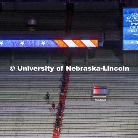 Navy and Marine ROTC members run up the east stadium steps. UNL ROTC cadets and Lincoln first responders run the steps of Memorial Stadium to honor those who died on 9/11. Each cadet ran more than 2,000 steps. September 9, 2021. Photo by Craig Chandler / University Communication.