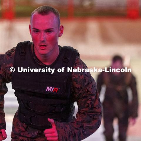 Navy Midshipmen and Marine option ROTC members and cadre run the east stadium steps Thursday morning. UNL ROTC cadets and Lincoln first responders run the steps of Memorial Stadium to honor those who died on 9/11. Each cadet ran more than 2,000 steps. September 9, 2021. Photo by Craig Chandler / University Communication.