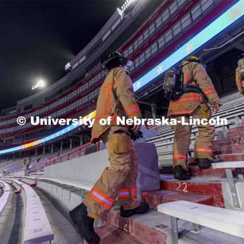 Lincoln Fire Department members run the west stadium steps. UNL ROTC cadets and Lincoln first responders run the steps of Memorial Stadium to honor those who died on 9/11. Each cadet ran more than 2,000 steps. September 9, 2021. Photo by Craig Chandler / University Communication.