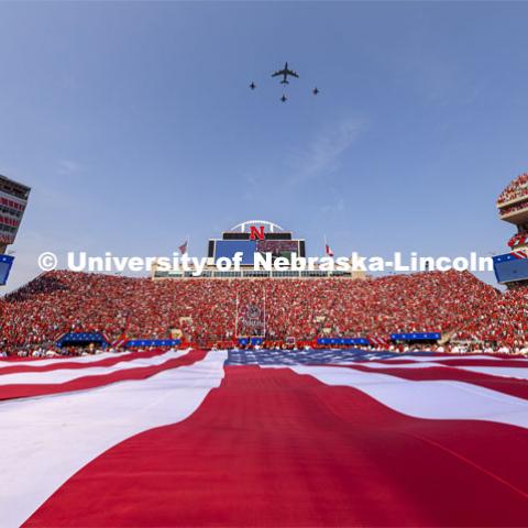 A KC-135 refueling tanker from Lincoln’s Nebraska Air National Guard 155th Air Refueling Wing flied in formation with fighter jets above the stadium. A US flag in the shape of the lower 48 states filled 50 yards of Tom Osborne Field for the national anthem. Nebraska vs. Buffalo University game on the 20th anniversary of 9/11. Photo by Craig Chandler/ University Communication.