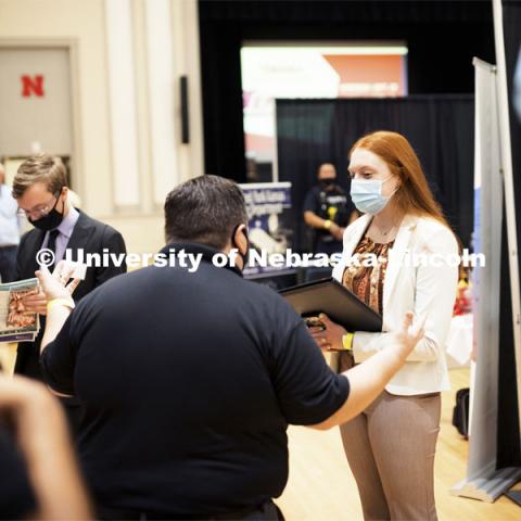 Meghan Schuette, a senior in international business and marketing, talks with Jonathan Fast, an Union Pacific recruiter at Tuesday’s Career Fair.  Day 1’s career opportunities center around the following career pathways: Business, Management and Operations, Training, Government & Public Administration, Human Services & Non-profit, Law, Public Safety & Security, Health & Public Health.  September 21, 2021. Photo by Craig Chandler / University Communication