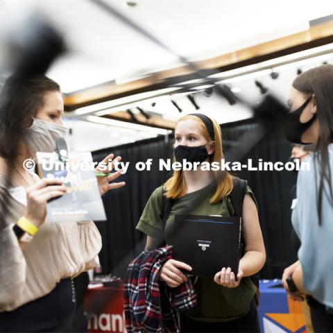 Kate Madsen, a junior in business administration, talks with recruiters at Tuesday’s Career Fair.  Day 1’s career opportunities center around the following career pathways: Business, Management and Operations, Training, Government & Public Administration, Human Services & Non-profit, Law, Public Safety & Security, Health & Public Health.  September 21, 2021. Photo by Craig Chandler / University Communication