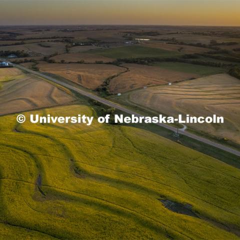 Corn and soybean fields in the final stages before harvest create a patchwork of colors at sunset bisected by Highway 43 in southeast Lancaster County. September 26, 2021. Photo by Craig Chandler / University Communication.