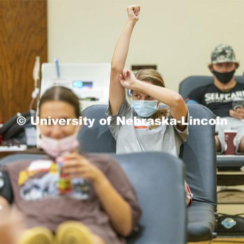 Caroline Carter, a junior from Omaha, holds her arm up following her donation. Homecoming week blood drive in Nebraska Union. September 28, 2021. Photo by Craig Chandler / University Communication.