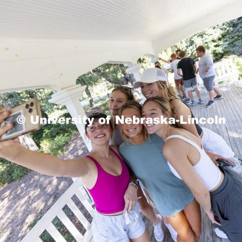 The Alpha Phi team takes a selfie on East Campus’ Perin Porch to show they solved their clue as another team receives their next clue in the background. Homecoming Traditions Race. The Traditions Race will consist of clues leading to 10-15 traditions around east campus, and the first three teams to find every tradition will be declared winners. September 28, 2021. Photo by Craig Chandler / University Communication.