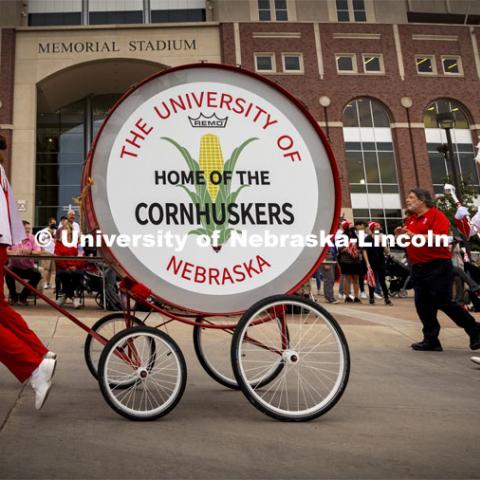 The restored Cornhusker Marching Band base drum leads the band down R Street Friday night.  The five-foot diameter drum, stand and wheels have been restored with a new drum cover. Homecoming Parade and Cornstalk Festival. October 1, 2021. Photo by Craig Chandler / University Communication.