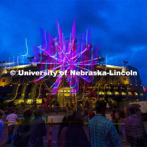 The east side of Memorial Stadium is lit up by the lights of the ferris wheel from the Homecoming Parade and Cornstalk Festival. Homecoming Parade and Cornstalk Festival. October 1, 2021. Photo by Craig Chandler / University Communication.