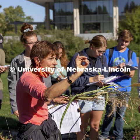 Kim Todd describes various landscape grasses as her HORT  214, Herbaceous Landscape Plants class walks around East Campus. October 4, 2021. Photo by Craig Chandler / University Communication.