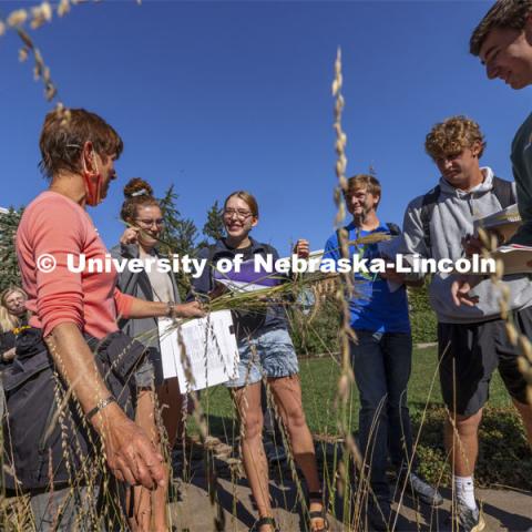 Kim Todd describes various landscape grasses as her HORT  214, Herbaceous Landscape Plants class walks around East Campus. October 4, 2021. Photo by Craig Chandler / University Communication.