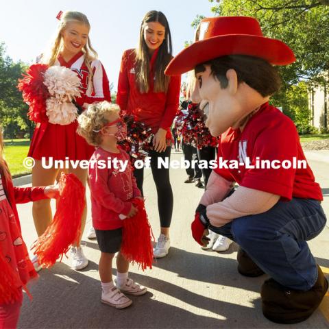To celebrate Campus Childcare Centers Week at the Ruth Staples Child Development Lab, Herbie Husker, the children, teachers, sprit squad members and band members had a parade from the flagpole by Chase Hall to Ag Hall. October 4, 2021. Photo by Craig Chandler / University Communication.