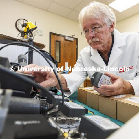 Senior Nebraska Mesonet technician Glen Roebke runs tests on a set of barometers for weather station sensors. A new sensor calibration lab has been developed by the Nebraska State Climatology Office at the University of Nebraska-Lincoln School of Natural Resources. October 7, 2021. Photo by Craig Chandler / University Communication