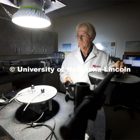 Senior Nebraska Mesonet technician Glen Roebke runs tests on a set of solar radiation sensors for weather stations. A new sensor calibration lab has been developed by the Nebraska State Climatology Office at the University of Nebraska-Lincoln School of Natural Resources. October 7, 2021. Photo by Craig Chandler / University Communication