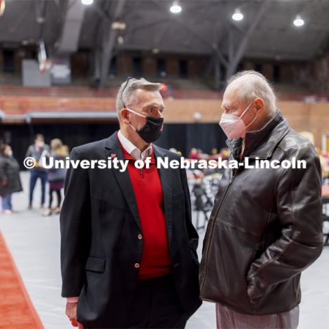 Chancellor Ronnie Green talks with James Van Etten for his 55-year career at the university. Salute to Service gathering in the Coliseum. November 18, 2021. Photo by Craig Chandler / University Communication.