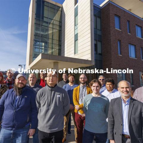 Ilya Kravchenko, Dan Claes, Frank Golf and Ken Bloom are members of Nebraska’s Department of Physics and Astronomy who collaborate with partners at the European Organization for Nuclear Research, known as CERN. Their work involves CERN’s Large Hadron Collider, an image of which is behind the researchers in this photo.