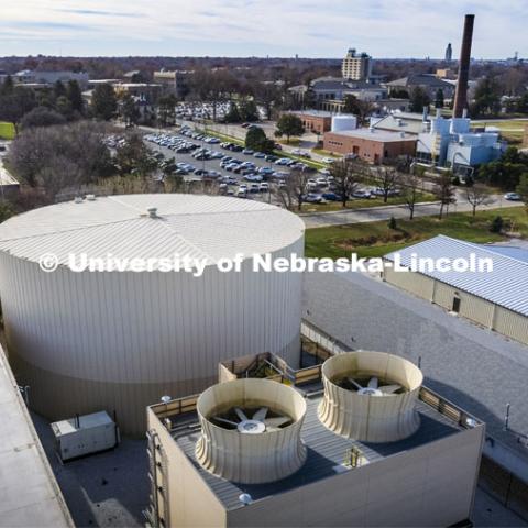 Thermal Energy storage tank on East Campus with the East Campus Power Plant (smokestack) in the background. UNL Utility Plants. November 29, 2021. Photo by Craig Chandler / University Communication.