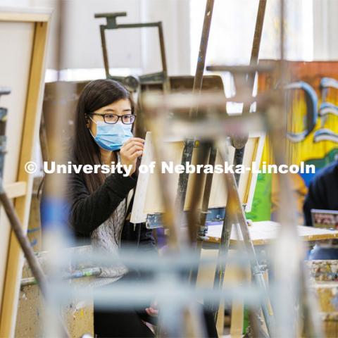 Nancy Nguyen, senior from Lincoln, works on a sketch in Aaron Holz’ Intermediate Painting class in Richards Hall. December 1, 2021. Photo by Craig Chandler / University Communication.