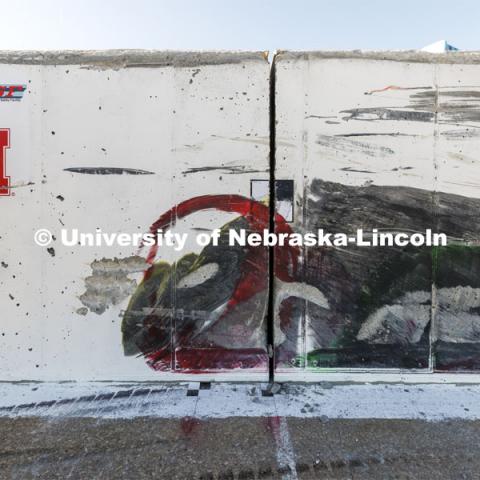 A red smear shows where one of the wheels left a mark on the barrier along with the rest of the tanker. Researchers from the Midwest Roadside Safety Facility conducted a rare tractor-tanker crash to test how a newly designed and significantly less tall concrete roadside barrier performs in a crash. The test was at the facility’s Outdoor Proving Grounds on the western edge of the Lincoln Municipal Airport. December 8, 2021. Photo by Craig Chandler / University Communication.