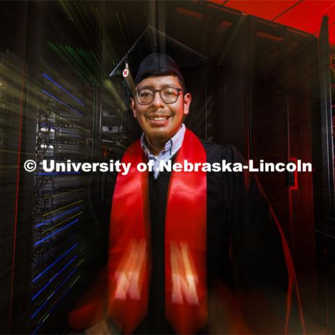 Bryan Chavez, a first-generation student who graduates Dec. 18 with degrees in computer science and mathematics, stands in front of a supercomputer in the Holland Computing Center. Chavez's success on campus was fueled by support received through the Nebraska College Prep Academy. December 09, 2021. Photo by Craig Chandler / University Communication.