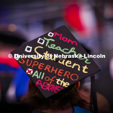 Emily Laura Brooks decorated her mortar board. She was awarded her masters in teaching, learning and teacher education. Graduate Commencement at Pinnacle Bank Arena. December 17, 2021. Photo by Craig Chandler / University Communication.