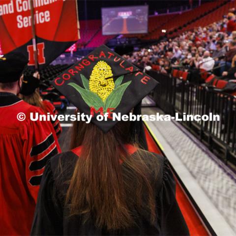 Sarah Burke decorated her mortar board for a corny look. Undergraduate Commencement at Pinnacle Bank Arena. December 18, 2021. Photo by Craig Chandler / University Communication.