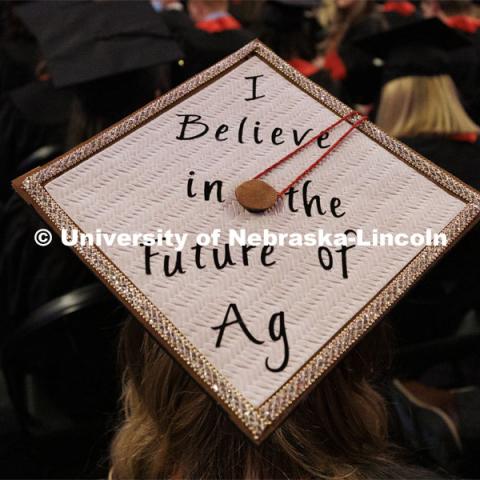 Decorated mortarboards at the Undergraduate Commencement at Pinnacle Bank Arena. December 18, 2021. Photo by Craig Chandler / University Communication.