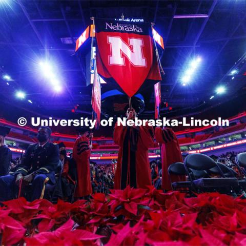 The Nebraska gonfalon leads the stage party into the arena. Undergraduate Commencement at Pinnacle Bank Arena. December 18, 2021. Photo by Craig Chandler / University Communication.