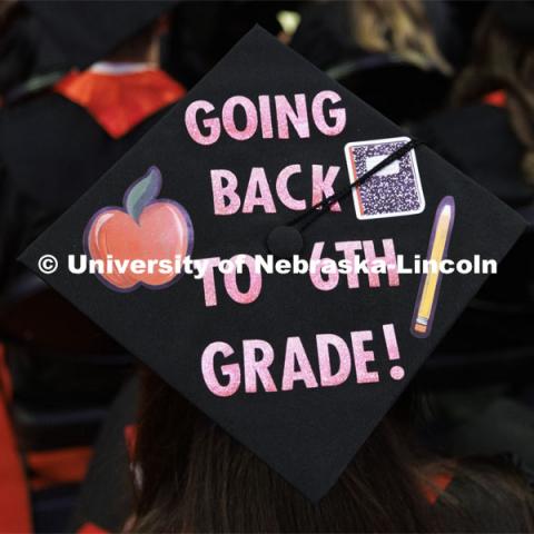 Decorated mortarboards at the Undergraduate Commencement at Pinnacle Bank Arena. December 18, 2021. Photo by Craig Chandler / University Communication.