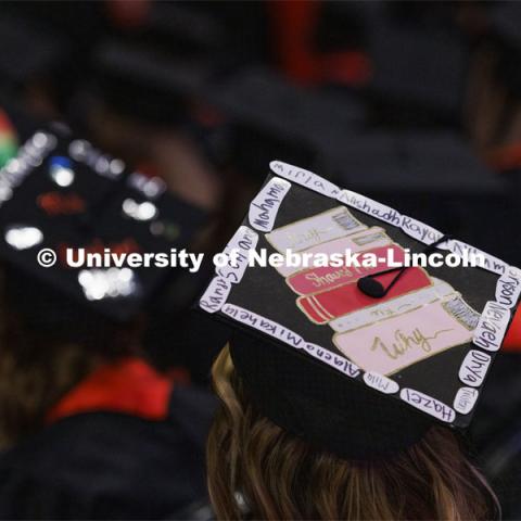 Decorated mortarboards at the Undergraduate Commencement at Pinnacle Bank Arena. December 18, 2021. Photo by Craig Chandler / University Communication.