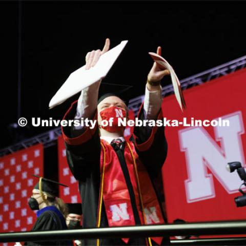 Arts and Sciences graduate Tyler Banark celebrates as he walks off the stage at the Undergraduate Commencement at Pinnacle Bank Arena. December 18, 2021. Photo by Craig Chandler / University Communication.