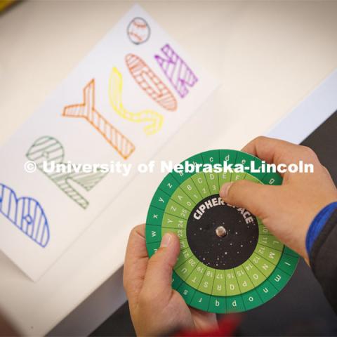 Bryson, 11, works with a cipher wheel during the "Galactic Quest" workshop at Crete Public Library. UNL honors students work as winterns for 4-H/Extension winternships and the Galactic Quest activities. January 4, 2022. Photo by Craig Chandler / University Communication.