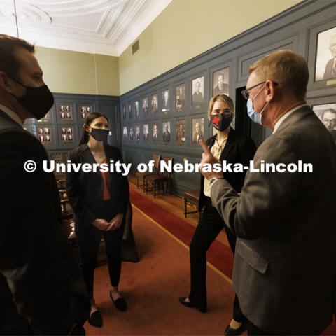 Ryan Sullivan, clinical associate professor of law (left), and Kevin Ruser, professor of law and director of clinical programs (right), talk with Nebraska Law students Jayden Barth and Rachel Tomlinson Dick after their arguments were finished. The two students argued a case before the Nebraska Supreme Court today. Both are third-year students mentored by Law Professor Ryan Sullivan. February 4, 2022. Photo by Craig Chandler / University Communication.