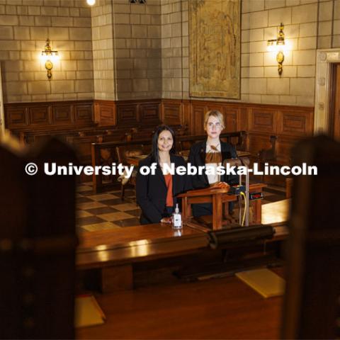Nebraska Law students Jayden Barth (left) and Rachel Tomlinson Dick delivered oral arguments in the Nebraska Supreme Court. Both are third-year students mentored by Law Professor Ryan Sullivan. They are pictured in the Supreme Court chambers. February 4, 2022. Photo by Craig Chandler / University Communication.