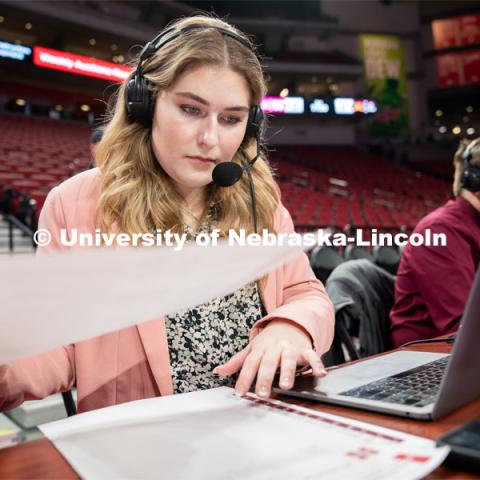 Hailey Ryerson organizes her notes before the Huskers’ Women’s Basketball match against Minnesota at Pinnacle Bank Arena. February 20, 2022. Photo by Jordan Opp / University Communication.