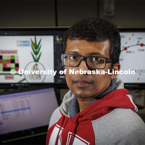 Rajib Saha, assistant professor of chemical and biomolecular engineering, and graduate student Niaz Bahar Chowdhury have created a genome-scale metabolic model for the corn root to study its nitrogen-use efficiency under nitrogen stress conditions. February 23, 2022. Photo by Craig Chandler / University Communication.