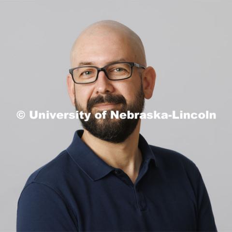 Studio portrait of Walker Pickering, Associate Professor for the School of Art, Art History and Design, Hixson-Lied College of Fine and Performing Arts. February 24, 2022. Photo by Craig Chandler / University Communication.