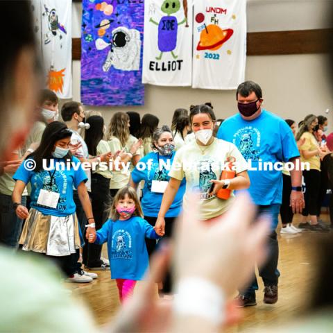 Miracle Family members who attend the marathon run through a cheering tunnel of students to start the marathon. University of Nebraska–Lincoln students exceeded their goal, raising over $230,000 during the annual HuskerThon on Feb. 26. Also known as Dance Marathon, the event is part of a nationwide fundraiser supporting Children’s Miracle Network Hospitals. The annual event, which launched in 2006, is the largest student philanthropic event on campus. The mission of the event encourages participants to, “dance for those who can’t.” All funds collected by the Huskers benefit the Children’s Hospital and Medical Center in Omaha. February 26, 2022. Photo by Jonah Tran / University Communication.



