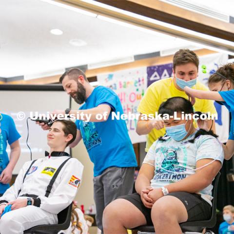 Students shave their hair to raise money. University of Nebraska–Lincoln students exceeded their goal, raising over $230,000 during the annual HuskerThon on Feb. 26. Also known as Dance Marathon, the event is part of a nationwide fundraiser supporting Children’s Miracle Network Hospitals. The annual event, which launched in 2006, is the largest student philanthropic event on campus. The mission of the event encourages participants to, “dance for those who can’t.” All funds collected by the Huskers benefit the Children’s Hospital and Medical Center in Omaha. February 26, 2022. Photo by Jonah Tran / University Communication.