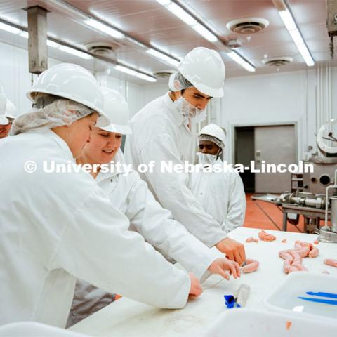 Students were encouraged to participate in the sausage-making process to further understand the lessons. UNL Meat Science club had a Sausage Making 101 course in the Animal Science Complex. February 28, 2022. Photo by Jonah Tran / University Communication.