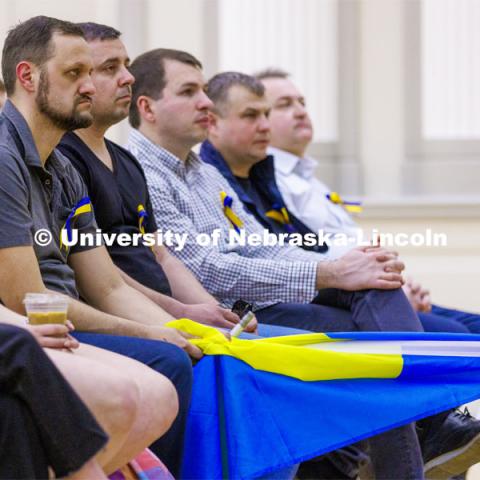 Mykhailo Smyshliaiev, a member of the Ukrainian community in Lincoln brought the Ukrainian flag to the event. Stand With Ukraine! panel discussion in the Nebraska Union ballroom Tuesday afternoon. March 1, 2022. Photo by Craig Chandler / University Communication.