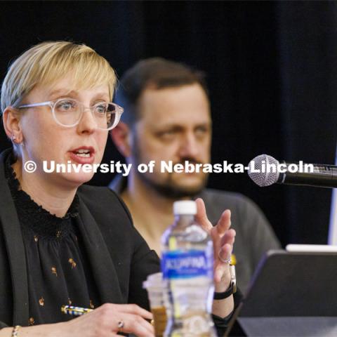 Courtney Hillebrecht, Director of Human Rights and Humanitarian Affairs, talks with the audience. In the background is Mykhailo Smyshliaiev, a member of the Ukrainian community in Lincoln. Stand With Ukraine! panel discussion in the Nebraska Union ballroom Tuesday afternoon. March 1, 2022. Photo by Craig Chandler / University Communication.