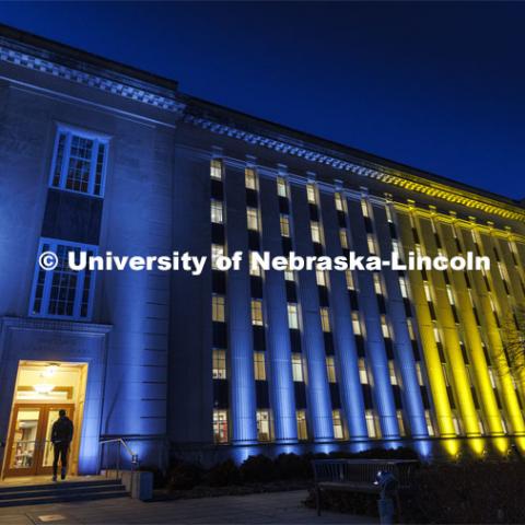 Love Library on the Nebraska’s City Campus is bathed in blue and yellow lights to show the world our hearts go out to our Husker family at home and abroad who are affected by the ongoing crisis in Ukraine. March 7, 2022. Photo by Craig Chandler / University Communication.