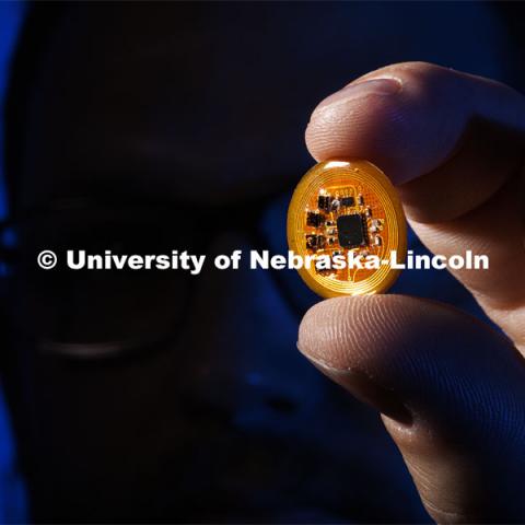 Eric Markvicka, Assistant Professor in Mechanical and Materials Engineering, has developed the smart nose. The wearable sensor can “smell” and diagnose the wearer’s medical condition. Nebraska Engineering researchers present, "Wireless, Battery Free Wearable Electronic Nose," March 10, 2022. Photo by Craig Chandler / University Communication.