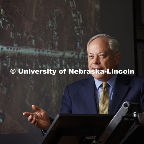 Jack Beard speaks about the use of commercial satellites in the Ukraine war. On the screen behind him is a commercial satellite image of the stalled Russian convoy in Ukraine. Beard has been acknowledged as the expert on war time use of commercial satellite imagery. Beard is an Associate Professor in the College of Law and Co-Director of the college’s Space/Cyber/Telecom Program. March 11, 2022. Photo by Craig Chandler / University Communication.