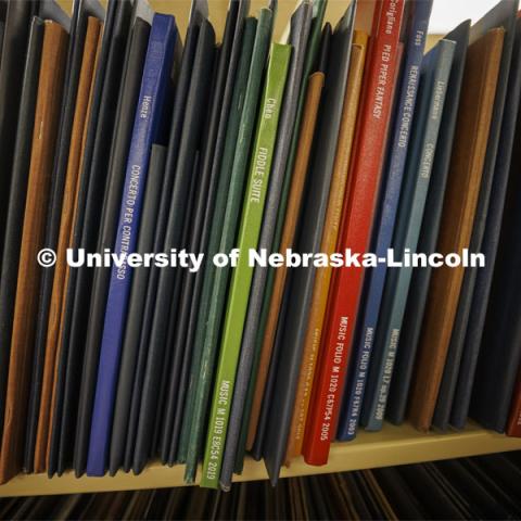 Approximately 3,000 scores of scores line the shelves in the library. Anita Breckbill, professor, oversees the Hixon-Lied School of Fine and Performing Arts music library in the basement of the Westbrook Music Center. March 18, 2022. Photo by Craig Chandler / University Communication.