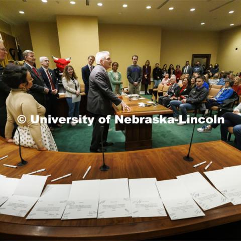 Senator John Stinner talks to the crowd. The table is covered with thank you notes to the senators being signed during the day. Fifth annual “I Love NU” advocacy event at the Nebraska State Capitol. March 23, 2022. Photo by Craig Chandler / University Communication.